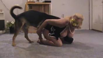 Older woman engaging in anal group sex with an aroused canine